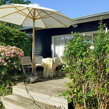 Feriehus Black-painted Wooden House From 1960 On Femo *